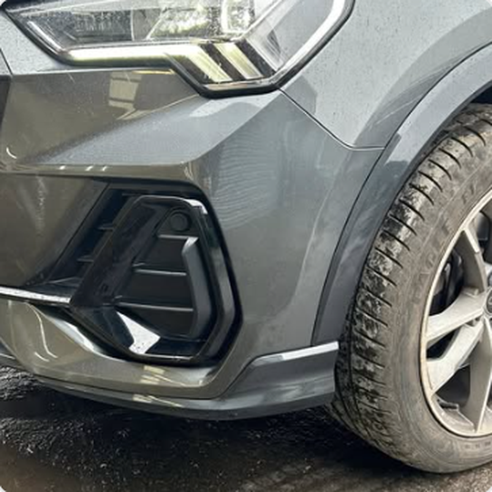 Grey vehicle front bumper damage repair